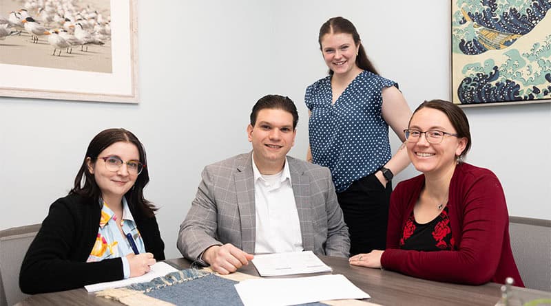 Gasbarro Law team of four, in their office, ready to work.